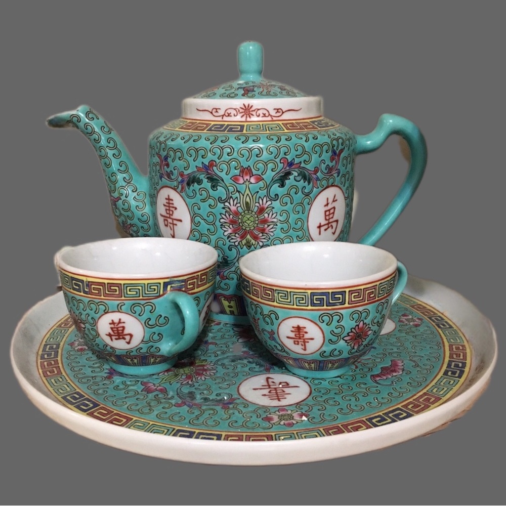 Elegant Teal Tea Set with Intricate Patterns
